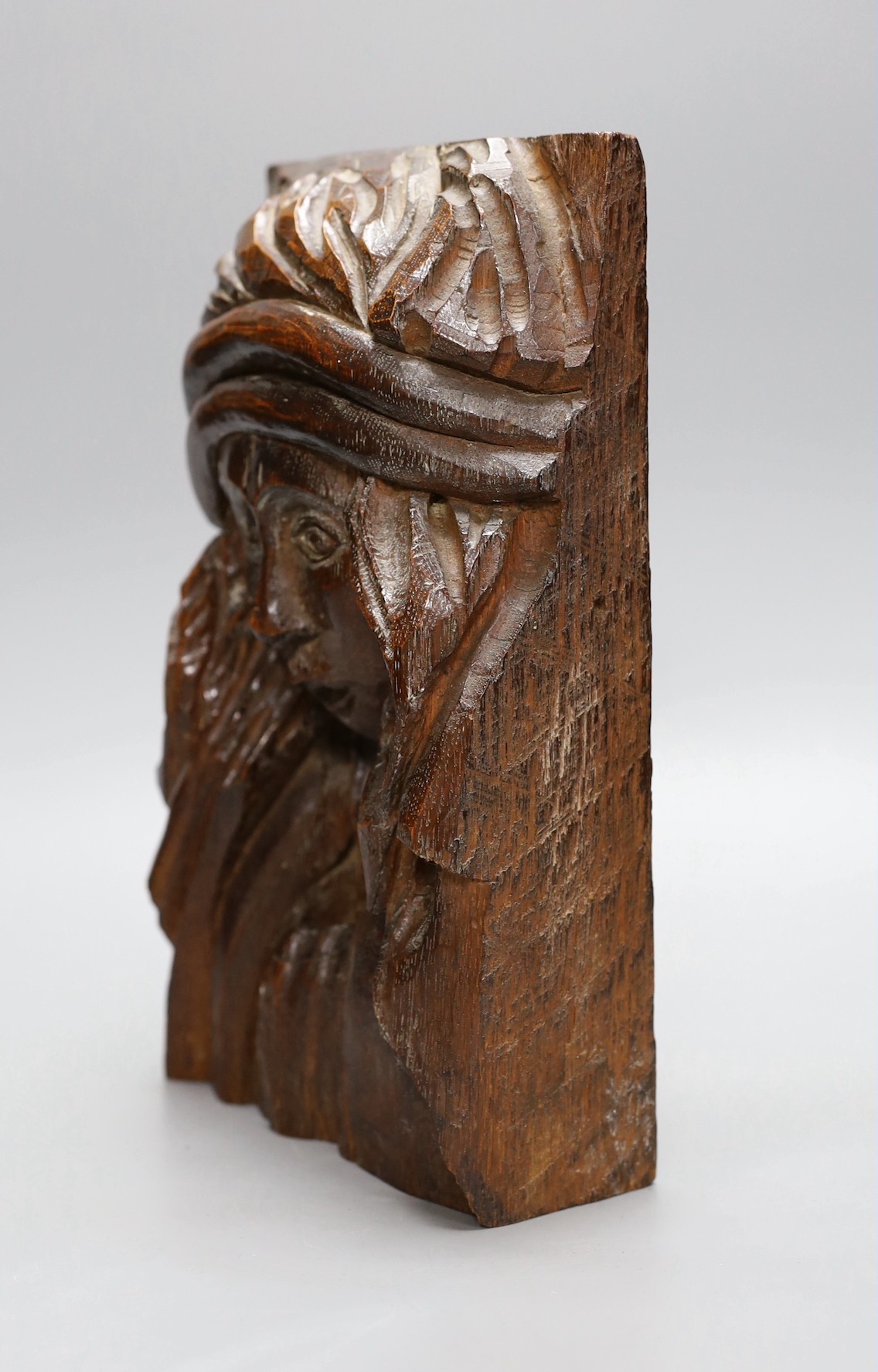 A carved oak figural appliqué, 28.5 cms high